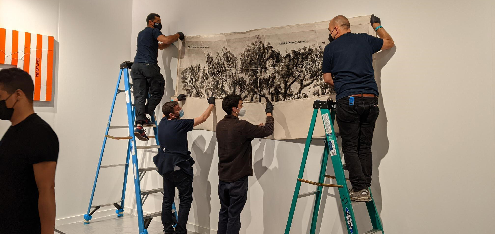 Artwork being installed in a gallery