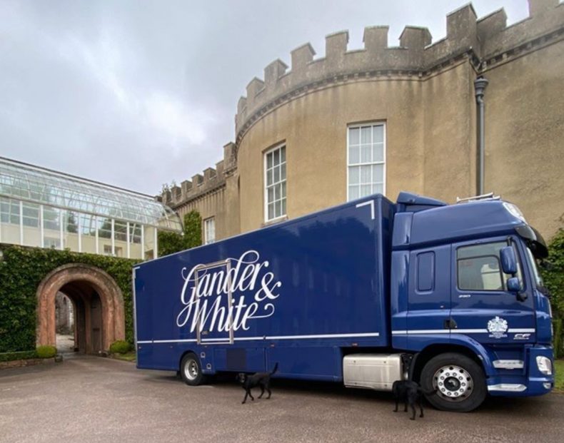 Gander and White Lorry outside a stately home