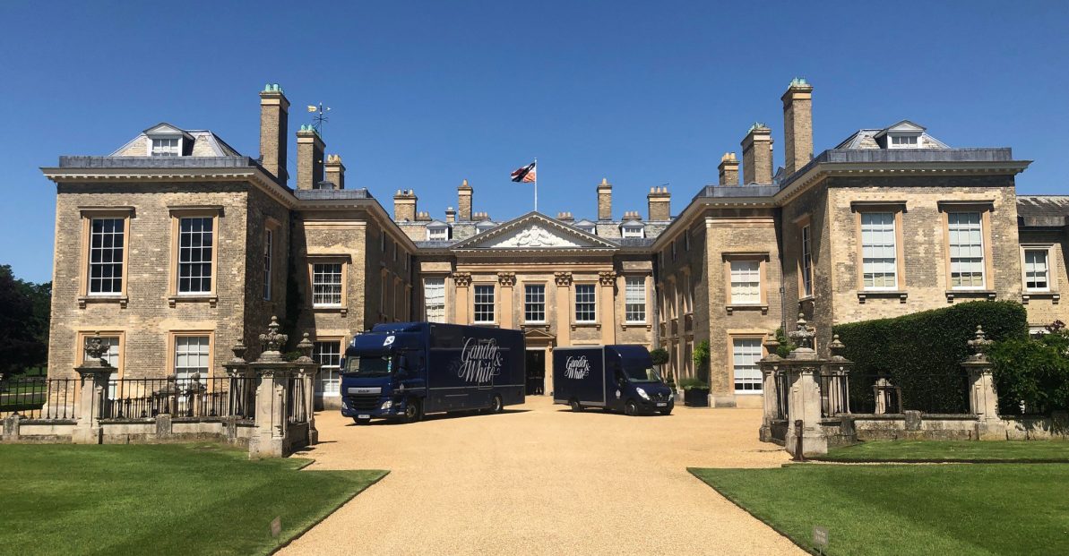 Gander and White branded transport outside a large stately home