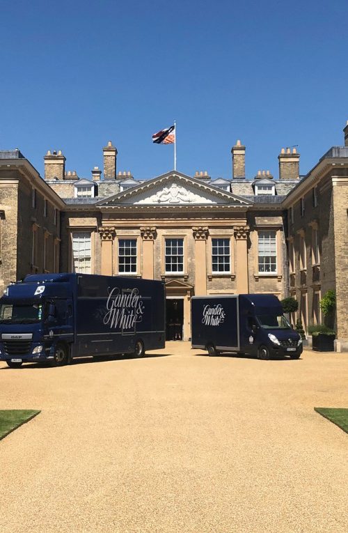 Gander and White branded transport outside a large stately home