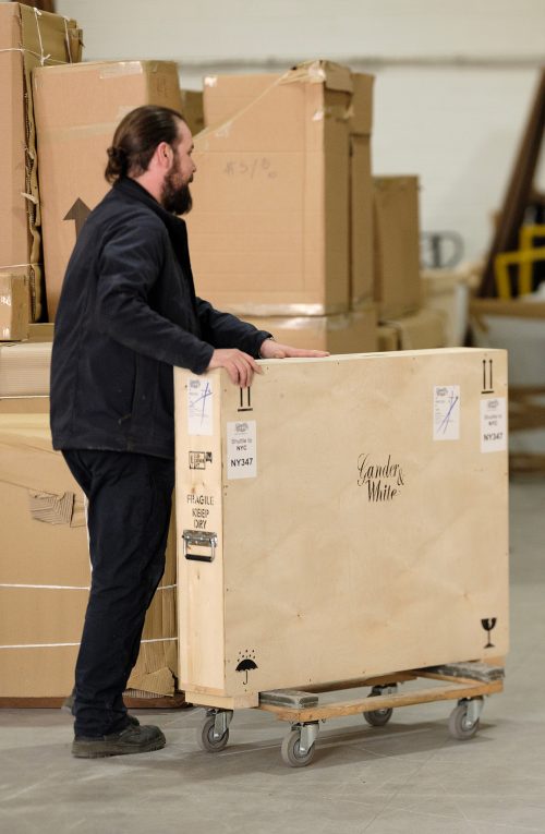 Fine Art Technician moving a crate